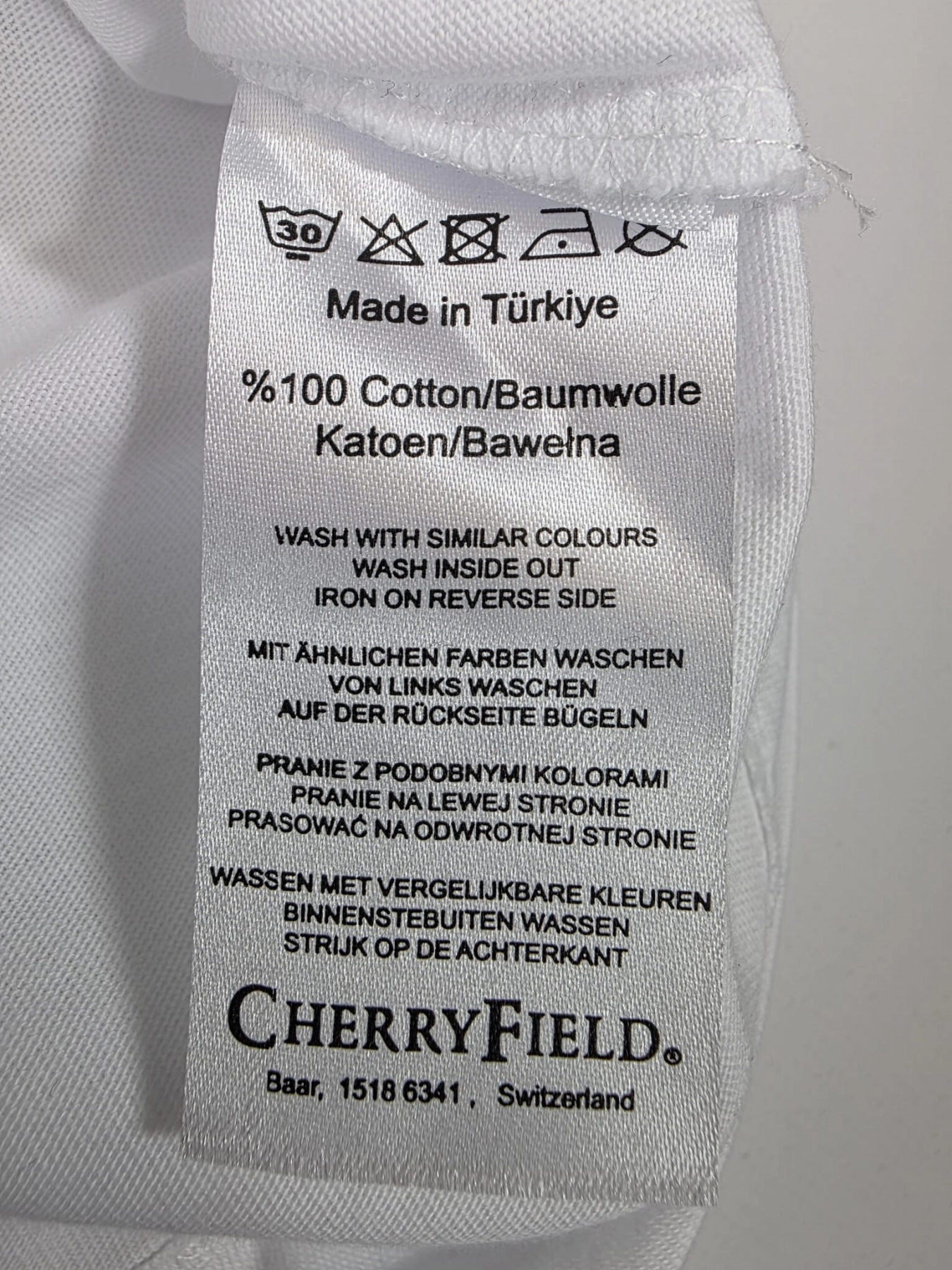 Elegancki longsleeve z unikalnym, czarnym detalem (nowy z metką!)
