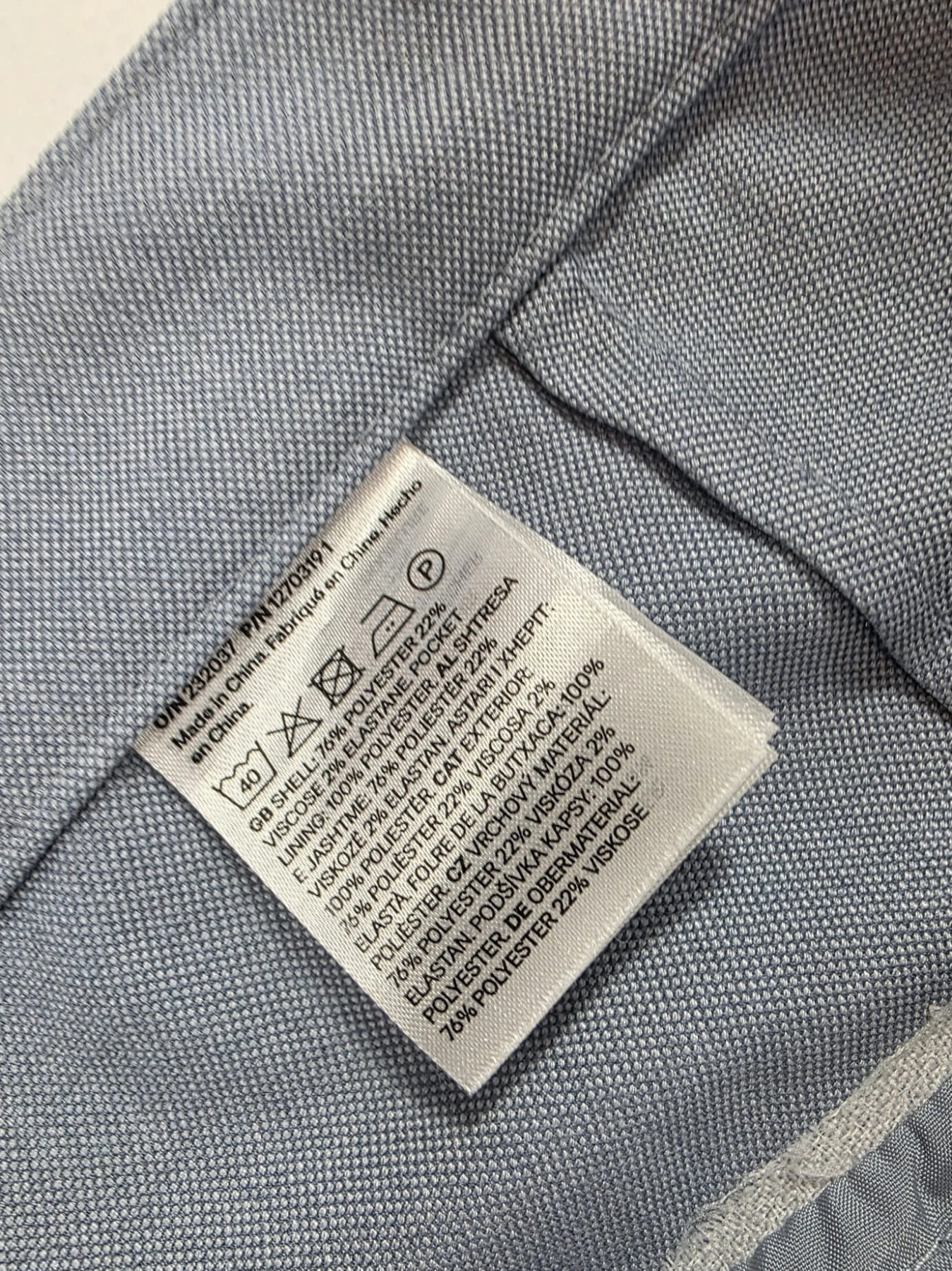 Błękitny komplet: pasiasta bluzka i eleganckie spodnie rozm.46