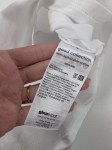 Piękny zestaw kobiecy, biały top ze stójką Gina Tricot i lawendowe bermudy Cubus, idealny na letnie dni
