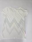 Stylowy zestaw damski składający się z szarych cygaretek House z wysokim stanem oraz białego t-shirtu Saint Tropez z cekinowym wzorem