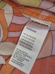 Ekskluzywny komplet damski premium składający się z białej koszuli InWear oraz wzorzystych spodni z szerokimi nogawkami Surkana, idealny na lato