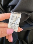 Markowy komplet damski składający się z czarnej bluzki oversize Made in Italy oraz bawełnianej spódnicy midi Lindex w kolorze musztardowym