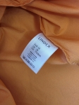 Markowy komplet damski składający się z czarnej bluzki oversize Made in Italy oraz bawełnianej spódnicy midi Lindex w kolorze musztardowym