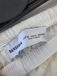 Kompletna stylizacja damska premium składająca się z lnianych spodni Bershka, bawełnianej bluzki Solar oraz limonkowej koszuli Catwalk Junkie