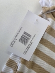 Modna stylizacja warstwowa składająca się z dopasowanej sukienki maxi w paski marki Chicaca oraz ażurowej narzutki boho Reserved wykonanej w 100% z bawełny