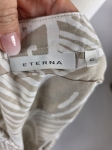 Markowa koszula damska Eterna w rozmiarze 40 z krótkim rękawem, ozdobiona subtelnym beżowo-białym wzorem, idealna do eleganckich i casualowych stylizacji premium