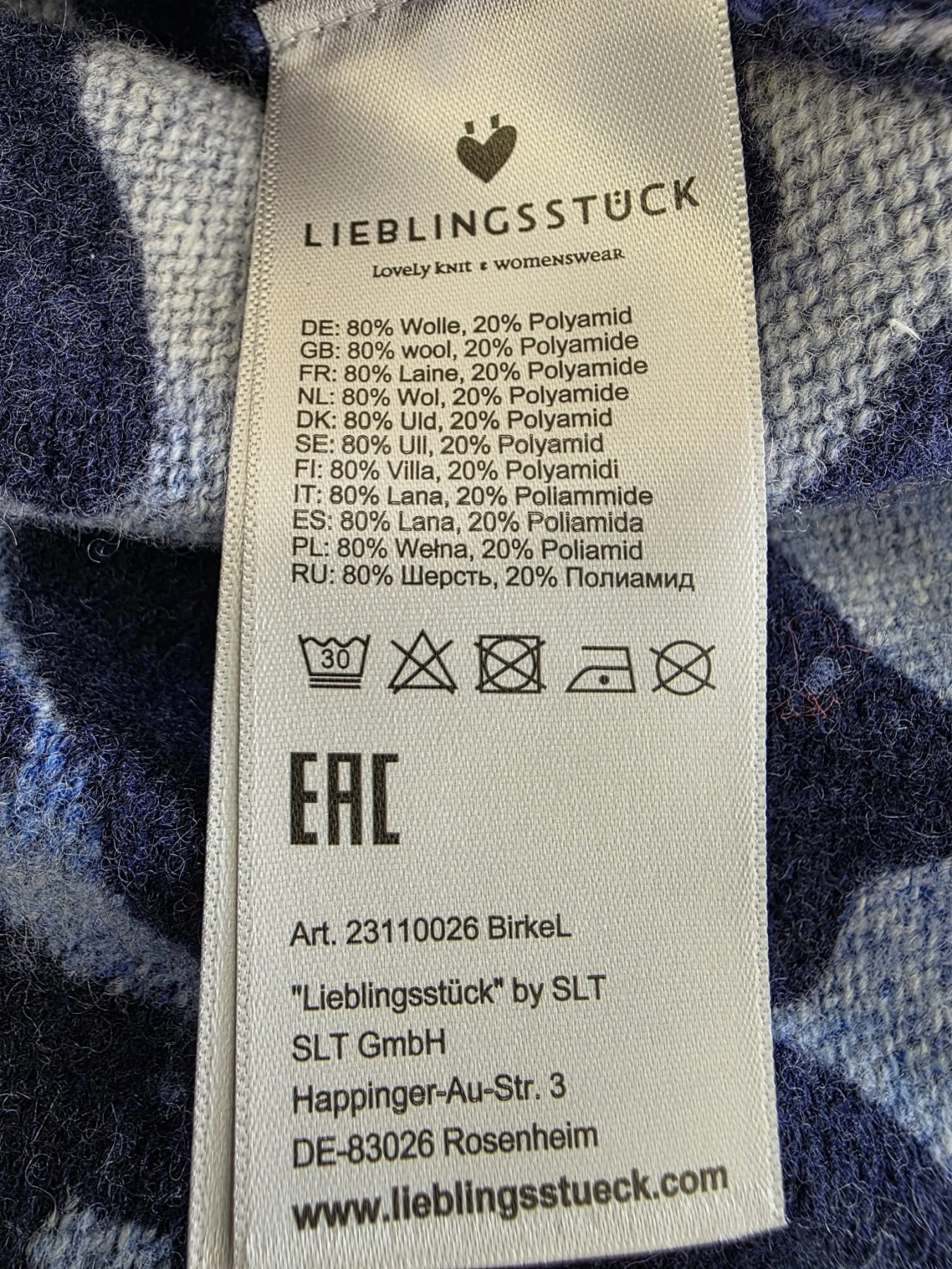 Damski niebieski sweter wełniany w panterkę marki Lieblingsstück o swobodnym kroju oversize, łączący styl, wygodę i ciepło