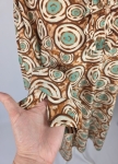 Tunika z ozdobną falbaną w hipnotyzujący, geometryczny print
